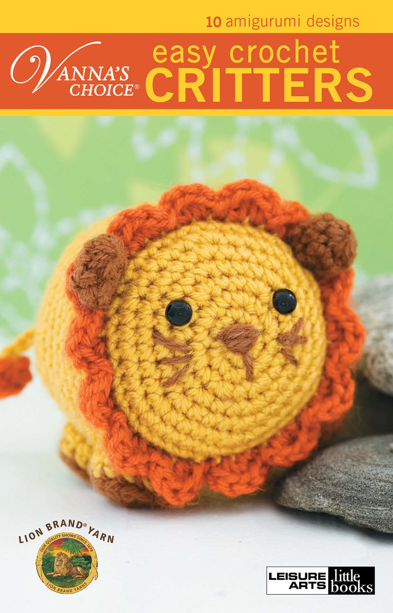Cover of "Vanna's Easy Crochet Critters" by Leisure Arts shows a small round lion with a yellow face, orange mane, and brown nose and eyes. Text: 10 beginner amigurumi designs for easy crochet fun.