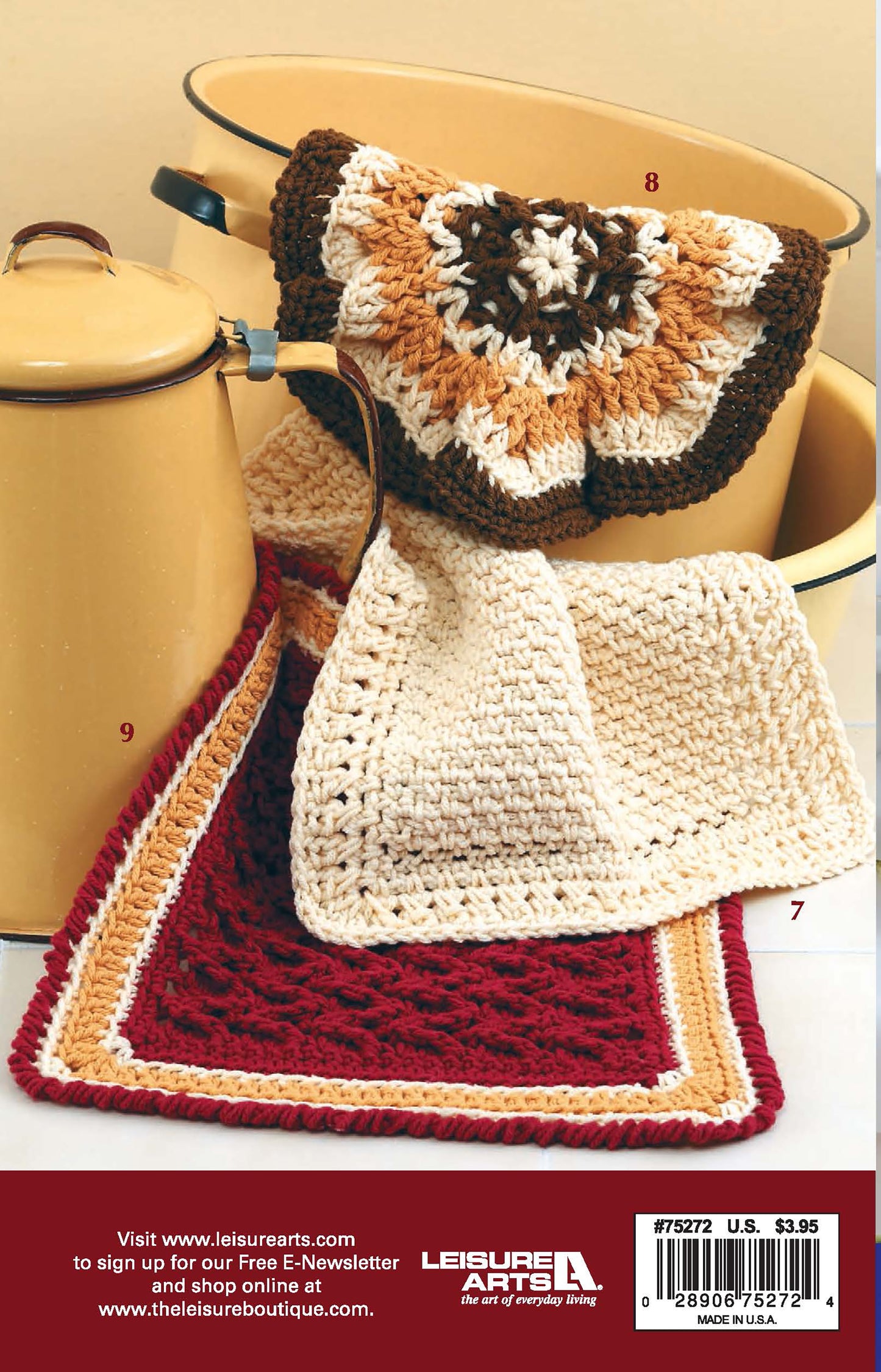 Three handmade crochet dishcloths from Leisure Arts' "All Washed Up—9 Crochet Dishcloths" set, in brown, cream, and red, feature textured stitch patterns and contrasting borders, displayed over a yellow pot for a charming touch.