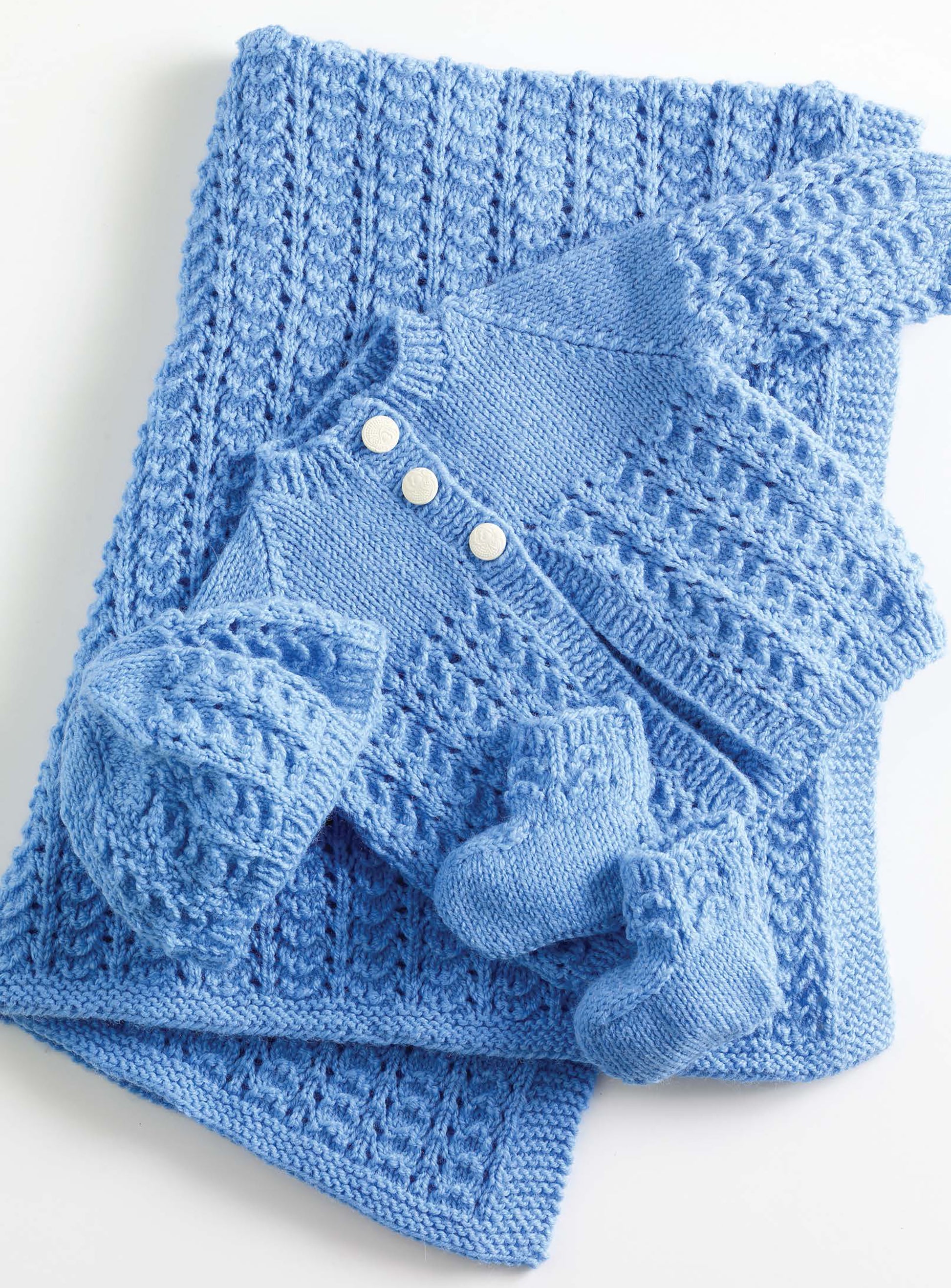 Small Comforts from Leisure Arts features 4 crochet and 2 knit designs created with Lion Brand Babysoft, including a matching set of baby clothes and blanket in soft blue lightweight yarn.