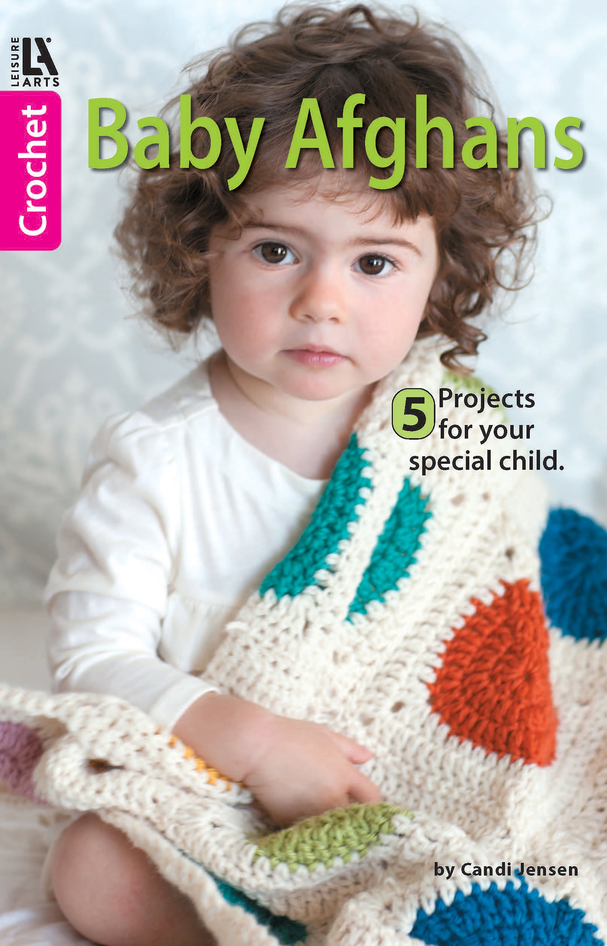A baby with curly brown hair holds a colorful crocheted blanket. The cover reads: Baby Afghans—Cuddly Wraps for Babies & Toddlers! by Leisure Arts, featuring easy crochet patterns for beginners.