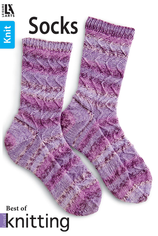 Two purple hand-knit socks with a wavy texture are shown on white. The text reads "Love of Knitting—Socks" by Leisure Arts, ideal for any knitting book or sock knitting pattern collection.