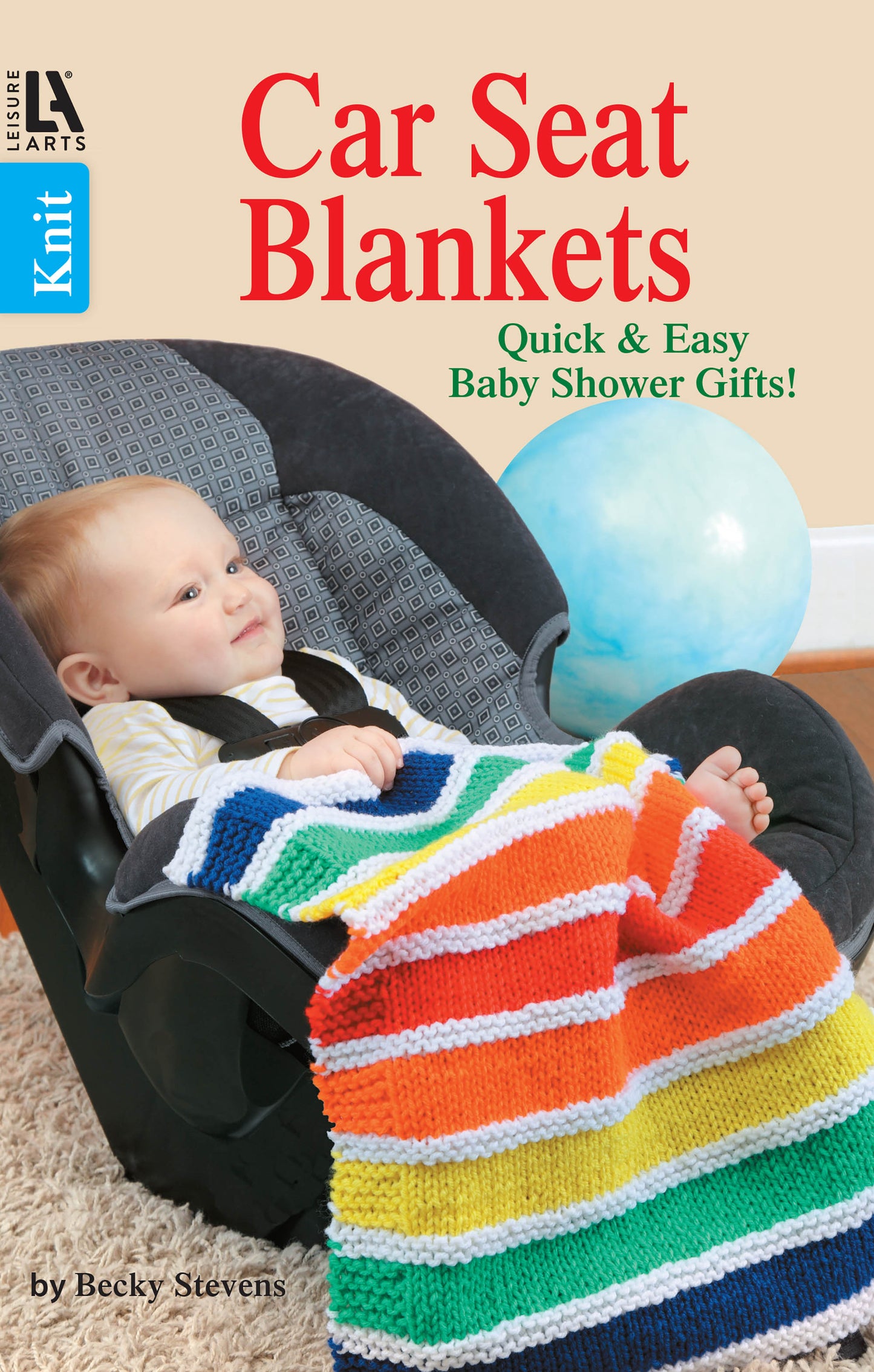 A baby sits in a gray car seat, covered with a colorful striped knit blanket. In the background is a blue ball and text promoting Knit Car Seat Blankets Digital Download by Leisure Arts—ideal for baby shower gifts or easy knitting projects.