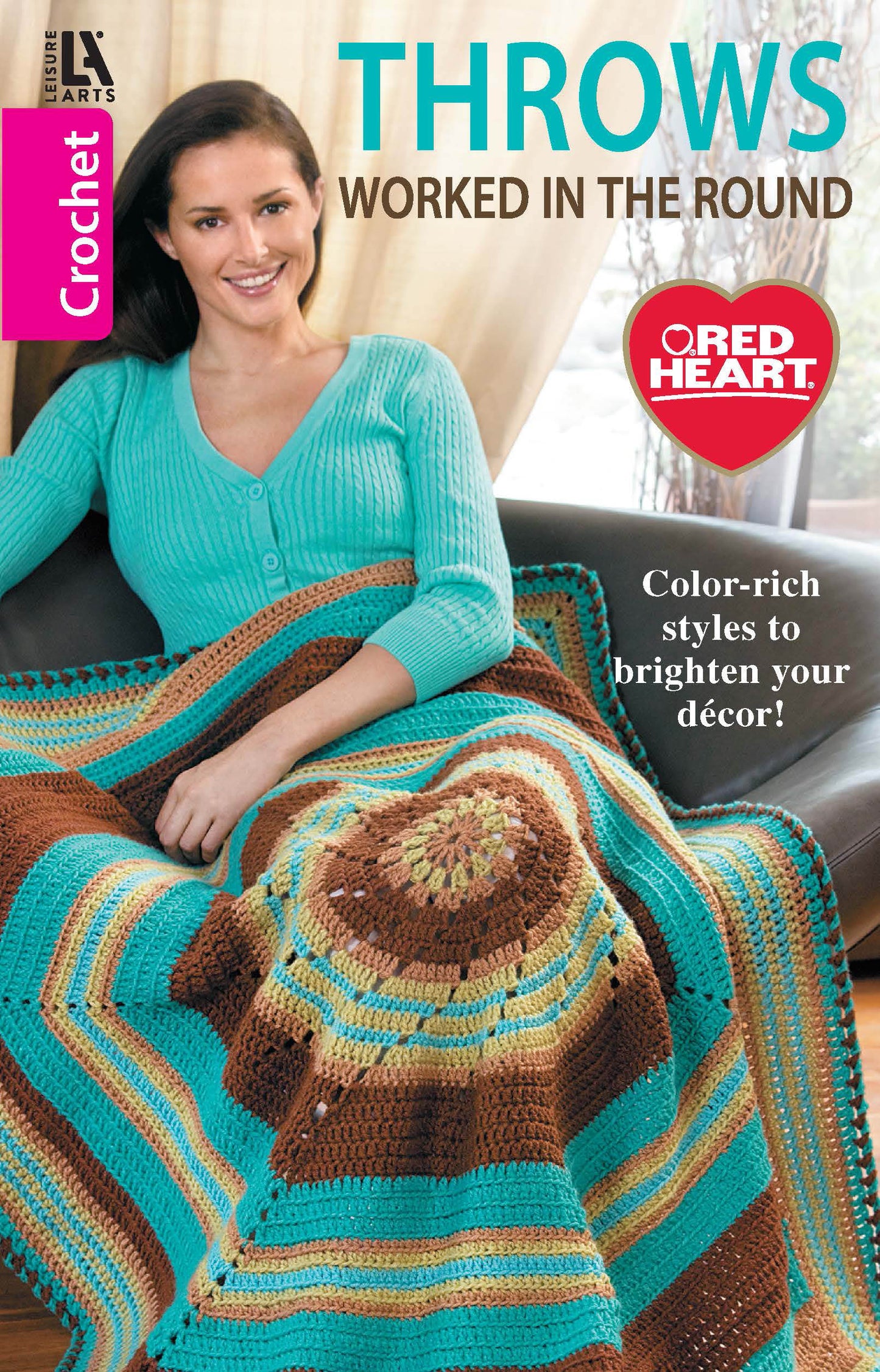A woman smiles on a couch with a colorful crocheted throw from "Crochet Throws Worked in the Round" by Leisure Arts. Text: Easy-to-intermediate round crochet afghan patterns—step-by-step instructions for vibrant, stylish throws!.