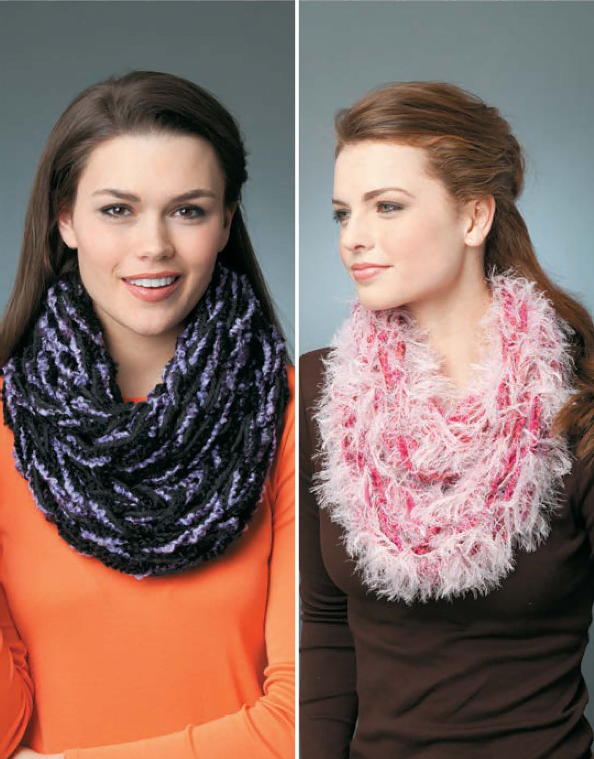 Two women model cozy infinity scarves made with Learn to Arm Knit by Leisure Arts; one wears a chunky black and purple cowl with an orange top, the other a fluffy pink and white scarf with a brown top. Both have long brown hair.