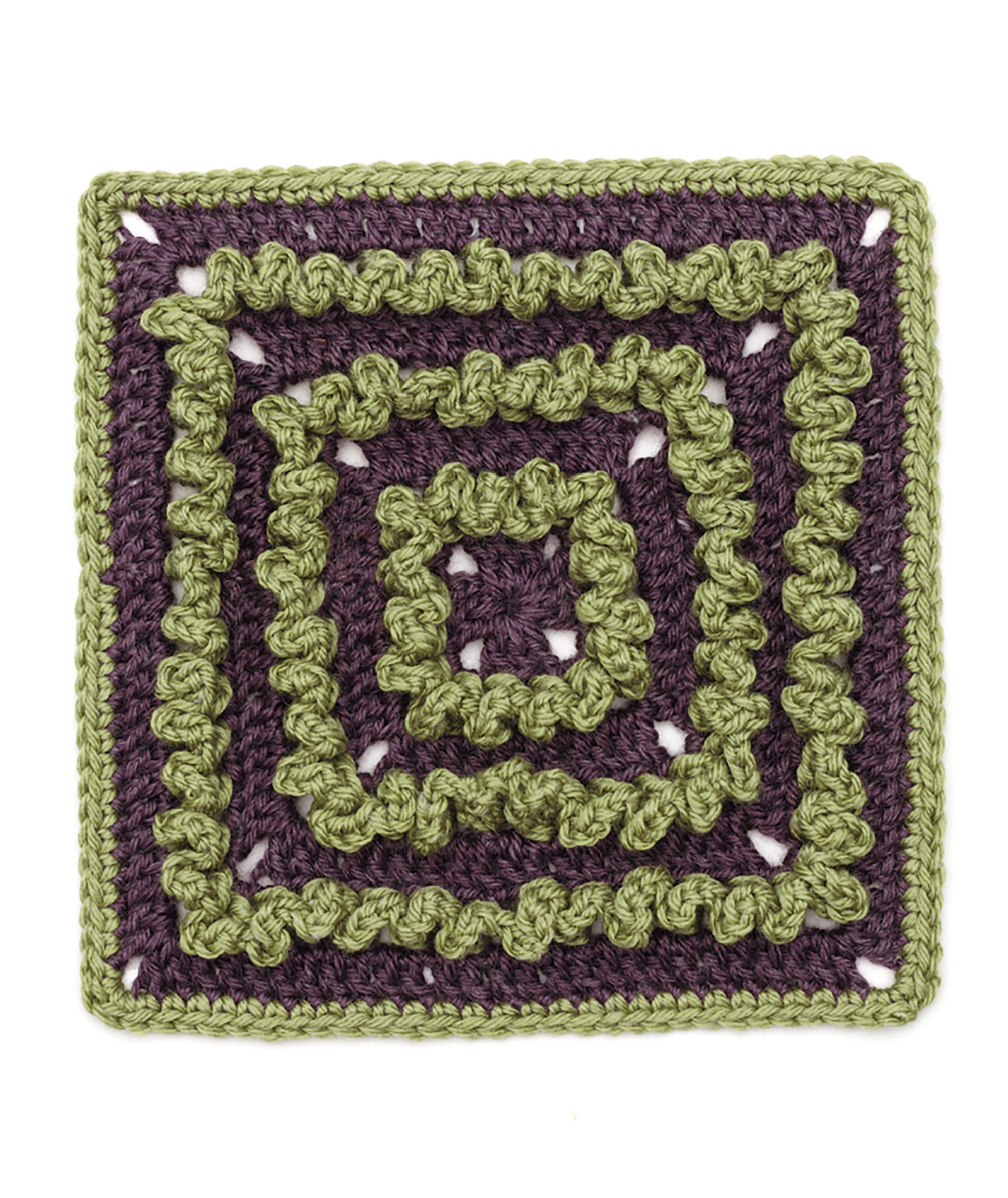 The Granny Square Stitch Guide by Leisure Arts features a spiral design with alternating olive green and dark purple yarn, creating a textured, raised crocheted square—great for sampler afghans.