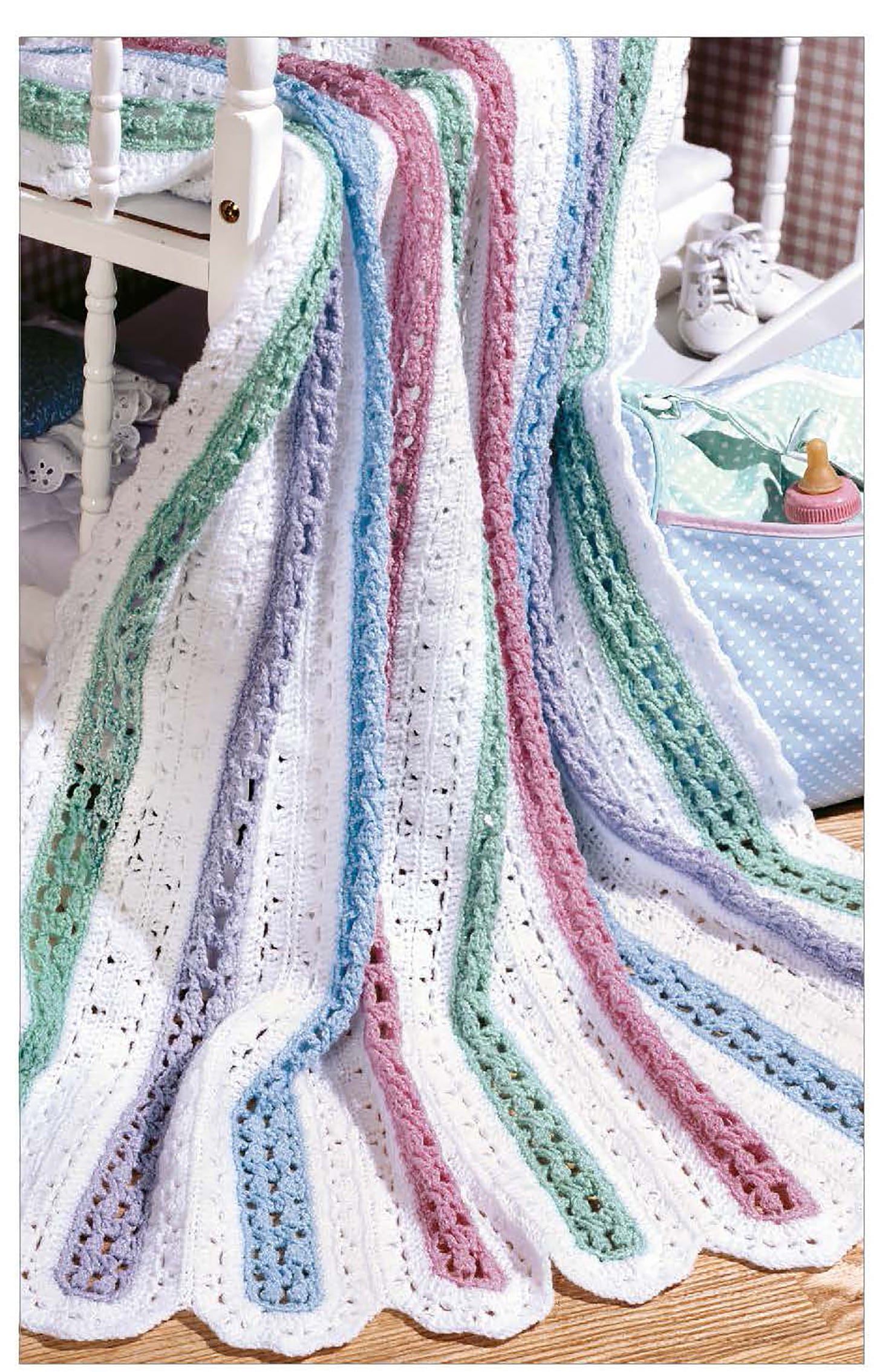 Discover charming crochet inspiration! "The Little Encyclopedia of Crocheted Baby Blankets" by Leisure Arts showcases scalloped baby blankets with pastel stripes—perfect for anyone seeking delightful patterns.