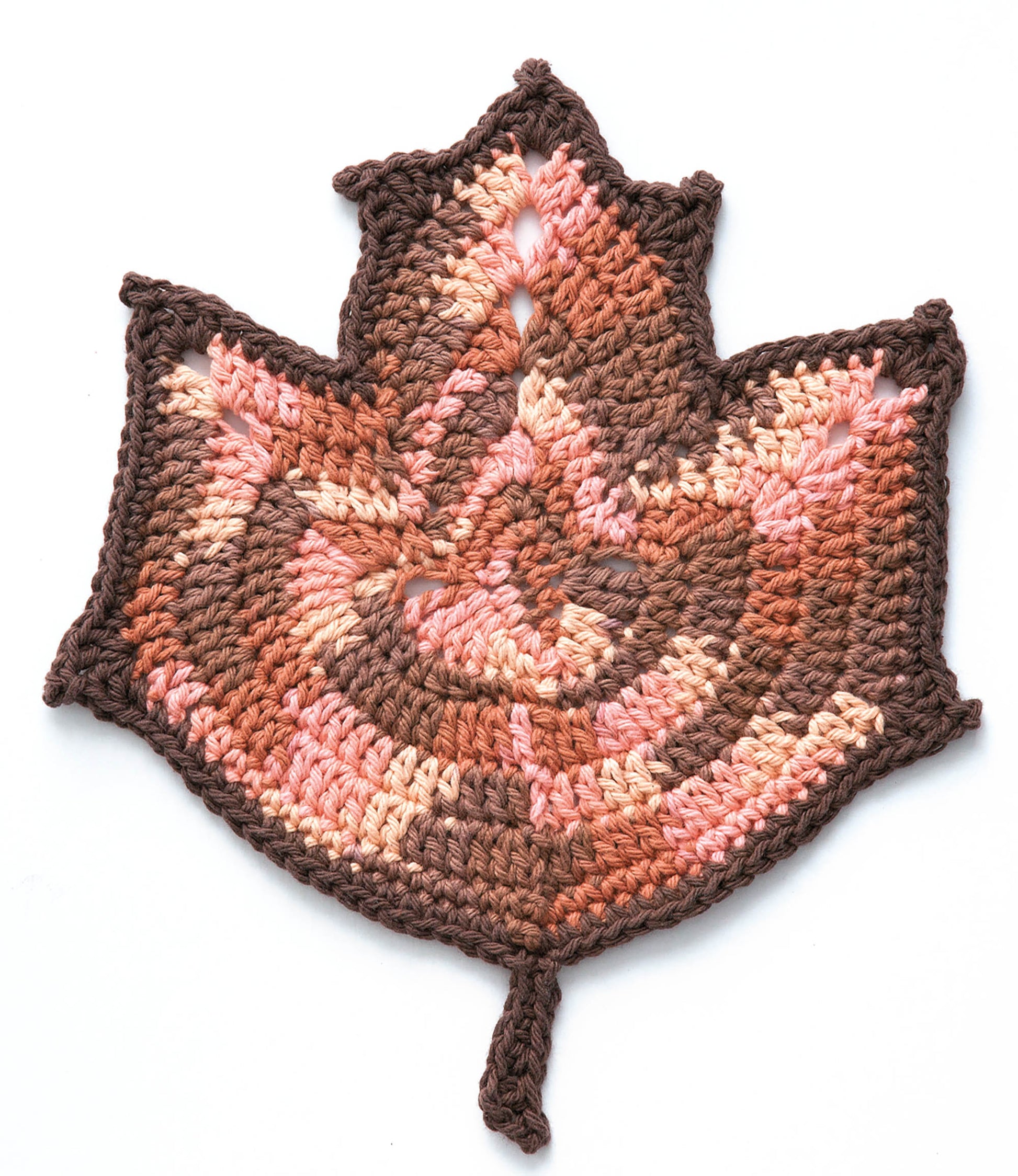 The Leisure Arts "A Dishcloth A Month" digital download offers beginner-friendly crocheted maple leaf patterns with intricate stitching and pointed stems—perfect for seasonal designs. Shown in brown, tan, and pink on a white background.