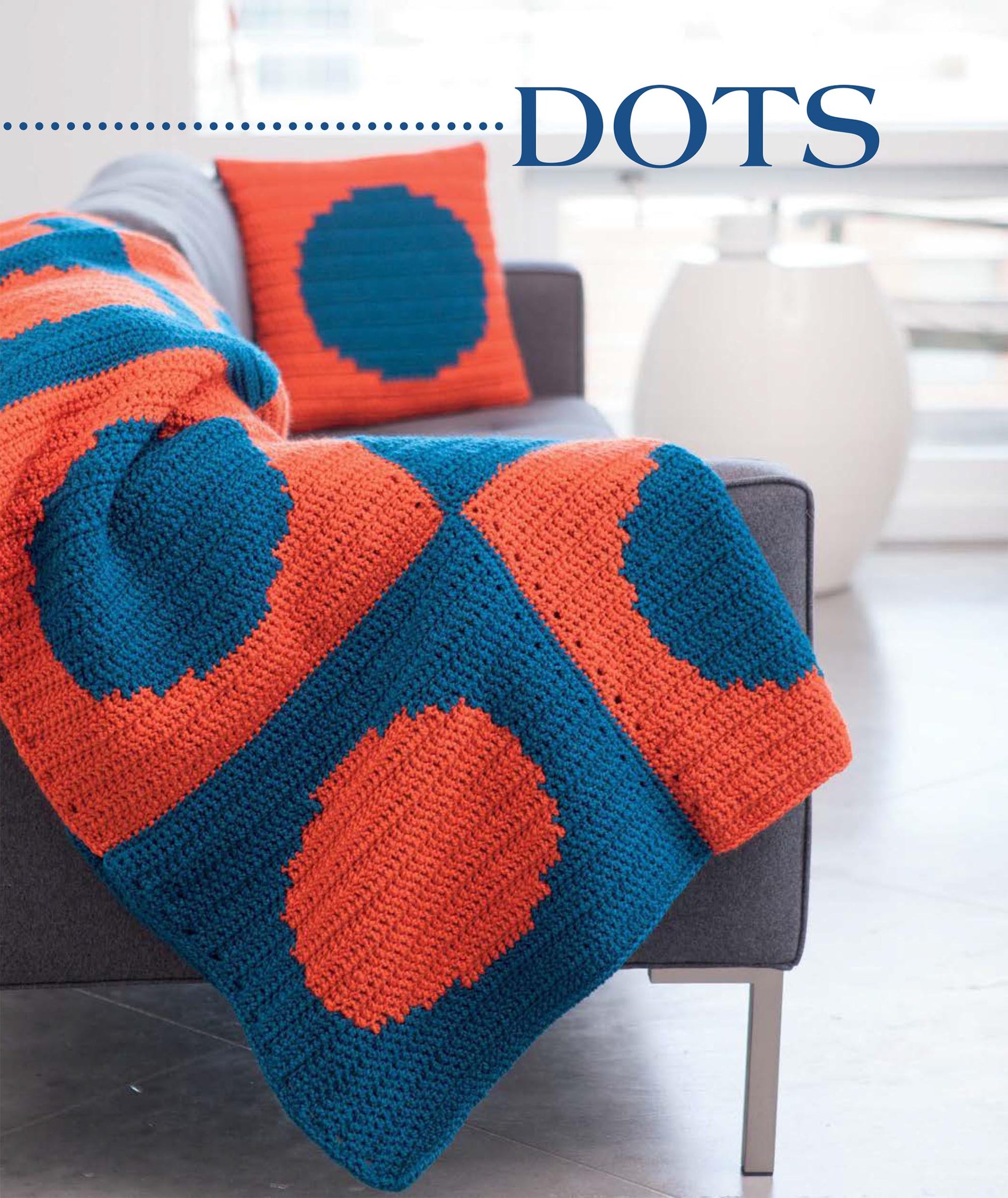 The Leisure Arts Geometric Pillows & Afghans set showcases bold circular colorwork on a crocheted orange and teal afghan and matching pillow—ideal for beginners seeking stylish crochet patterns for your home.