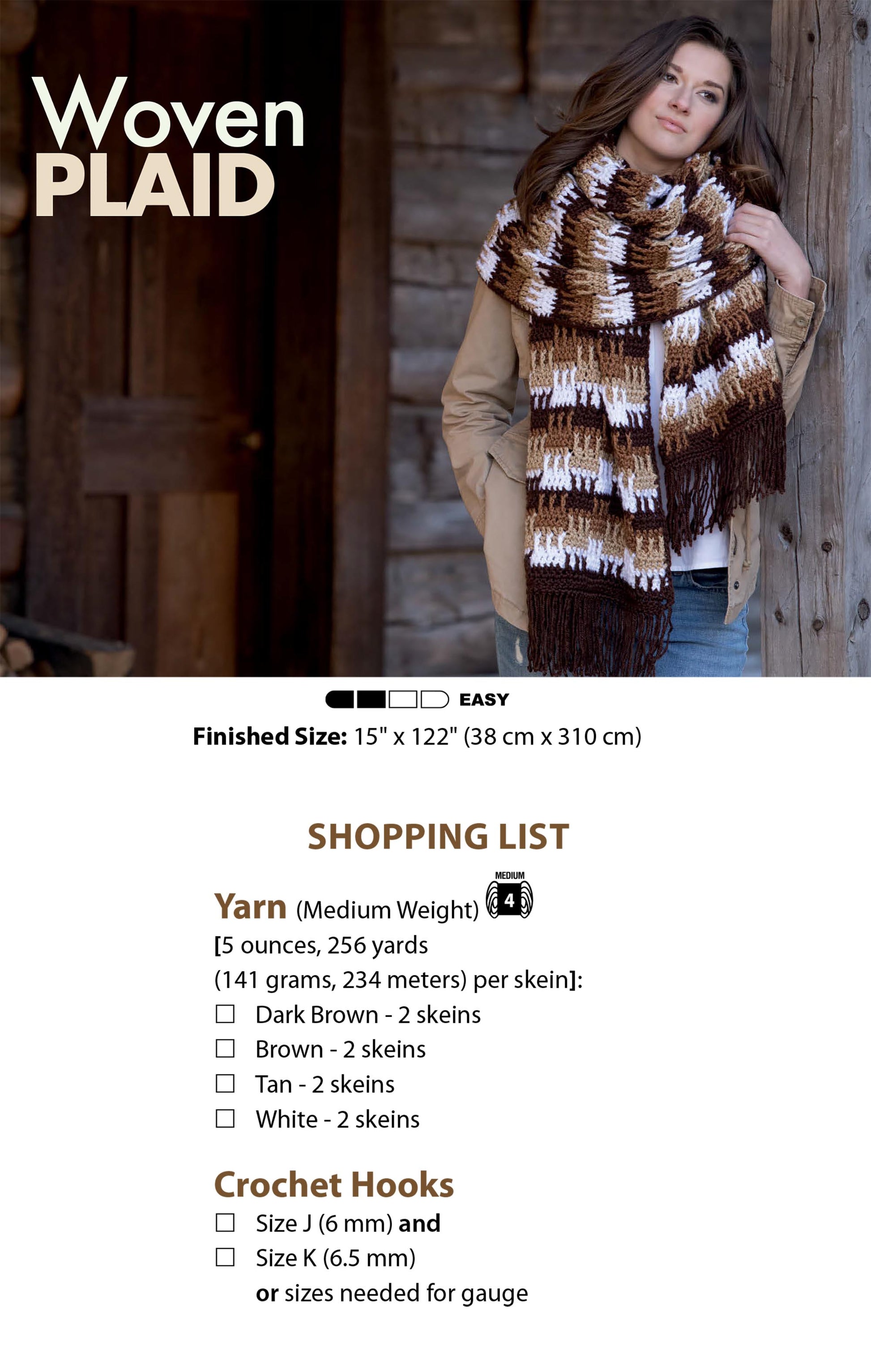 A woman leans against a wooden wall wearing a large plaid scarf in brown, tan, and white. Text shows yarn and hook needs for "Textured Super Scarves Crochet" by Leisure Arts—a stylish beginner crochet project.