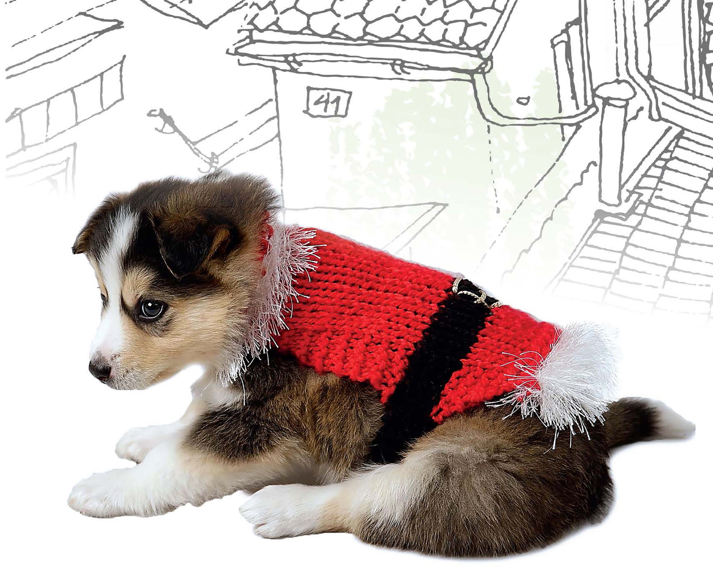 A small puppy in a red and black knit sweater with white trim sits by sketchy buildings—a charming scene inspired by "Knits for Pets" from Leisure Arts, perfect for creating pet crochet patterns or stylish dog sweaters.