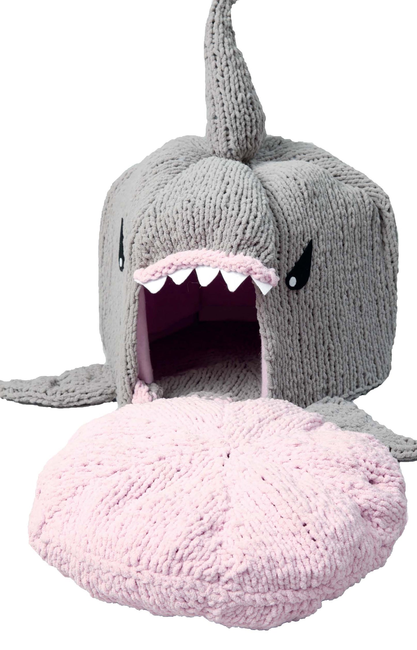 Knits for Pets by Leisure Arts features a gray shark-shaped bed with a wide open mouth, white felt teeth, and a soft removable pink cushion—perfect inspiration for whimsical beginner pet crochet projects.