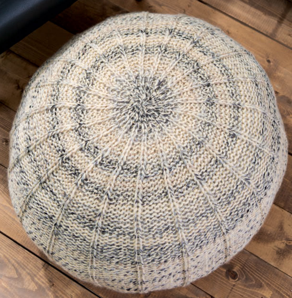 The Chunky Home Decor Digital Download by Leisure Arts features a round, knitted floor cushion in beige and gray—ideal inspiration for bulky yarn projects and cozy home accessories.