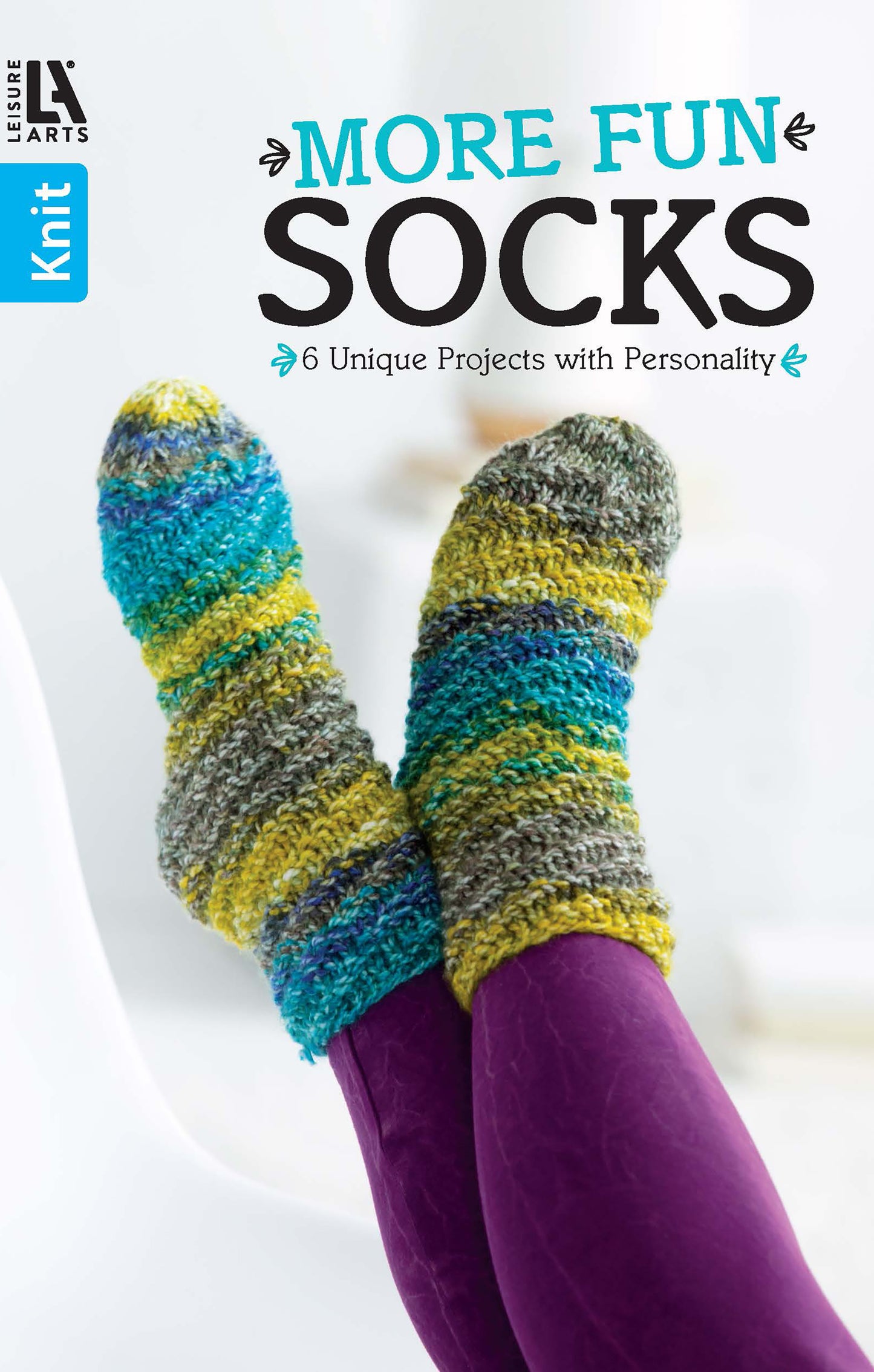 Relax in vibrant, textured knit socks—blue, green, yellow, gray—while reading "More Fun Socks" by Leisure Arts: 6 unique beginner projects full of personality.