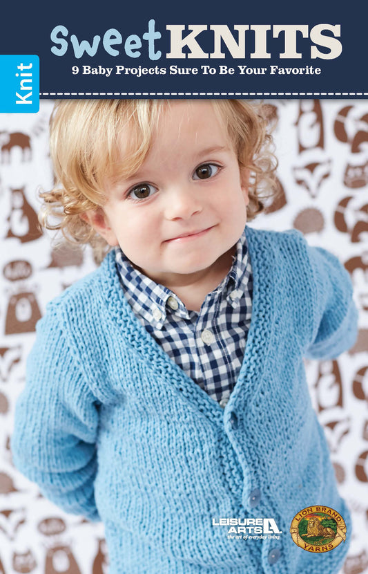 A young child with curly blonde hair wears a light blue knitted cardigan over a plaid shirt, standing before a patterned background on the cover of Leisure Arts’ Sweet Knits—9 Baby Projects, featuring charming handmade baby knitting patterns.