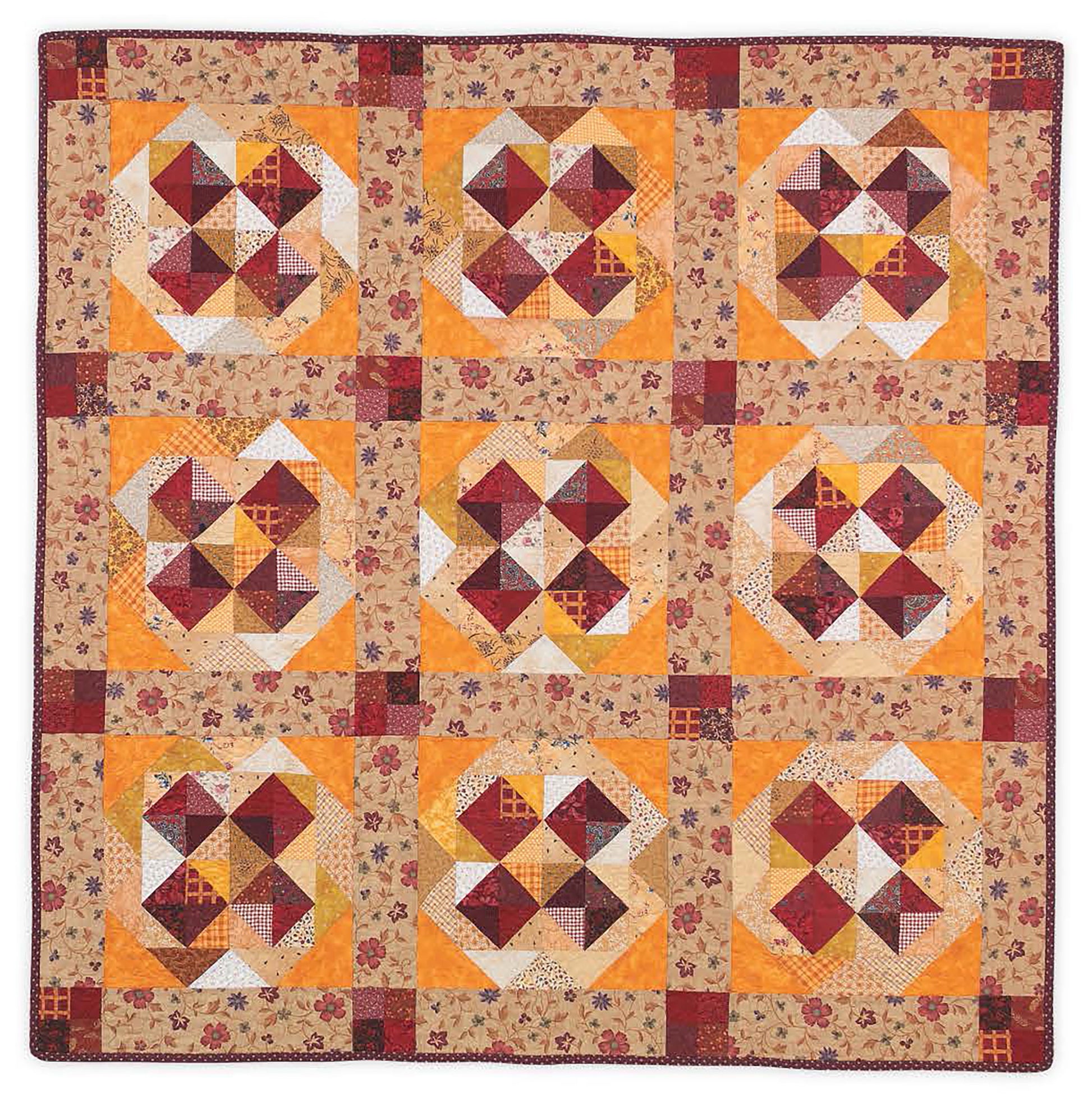 The Leisure Arts "It's Quilt Magic" digital download features nine heart-shaped patchwork blocks in red, yellow, and cream with classic patterns, a floral border, and red edge—a cozy design ideal for beginner quilters.