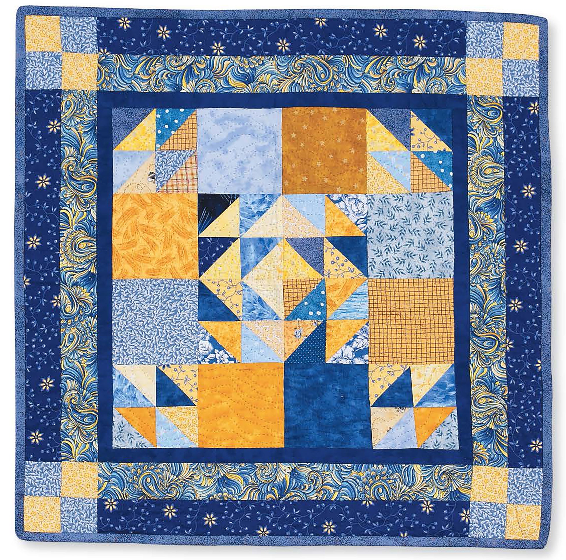 Leisure Arts' "It's Quilt Magic" Digital Download features a geometric patchwork quilt in blue, yellow, and white with triangle piecing and a floral border—ideal for beginners exploring quilt patterns.