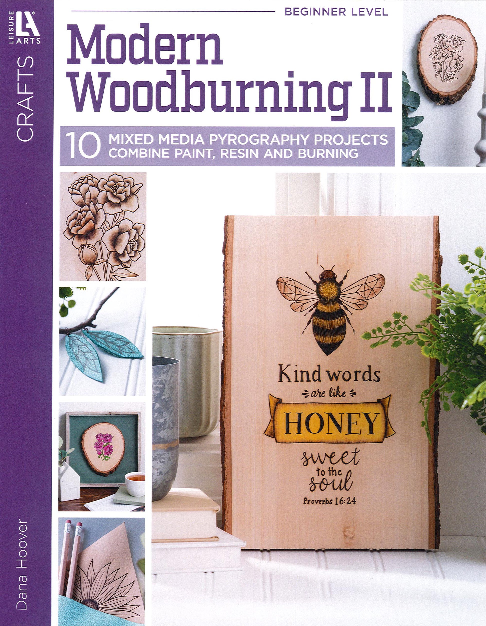 Cover of Modern Woodburning 2 by Leisure Arts features a wood plaque with a bee, flowers, and the text "Kind words are like HONEY sweet to the soul. Proverbs 16:24." Includes beginner tips and inspiring pyrography projects.