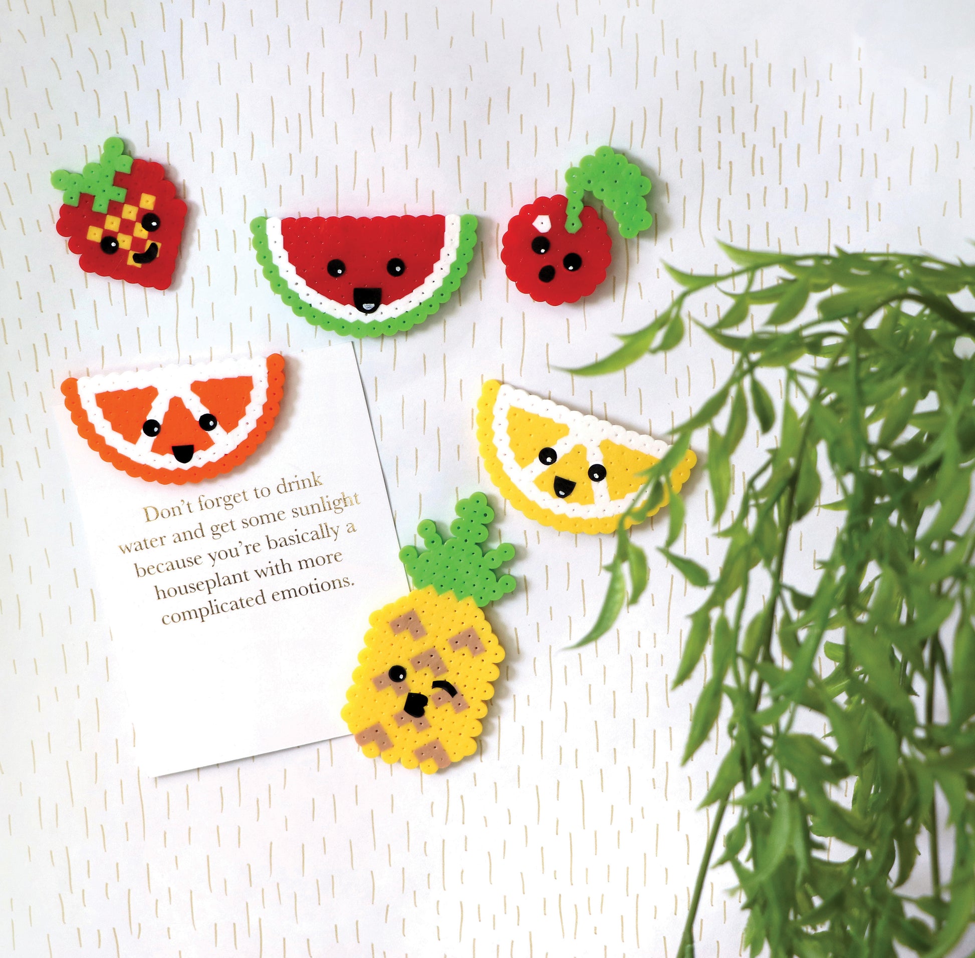 Colorful fruit designs made with Melt and Make Bead Crafts Digital Download by Leisure Arts (strawberry, watermelon, cherry, orange, lemon, pineapple) are displayed on a white background—great for beginner craft projects.