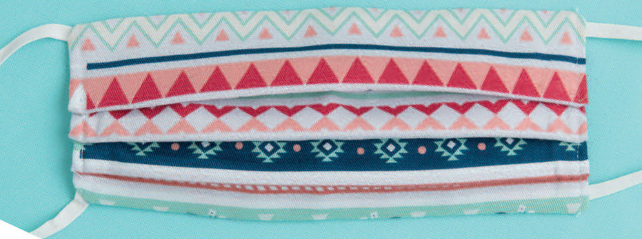 Discover unique sewing mask patterns with Leisure Arts’ Breathe Easy—8 Simple Sew and Applique Particle Mask and Cap Projects, featuring colorful geometric and tribal designs in coral, navy, mint, and white.