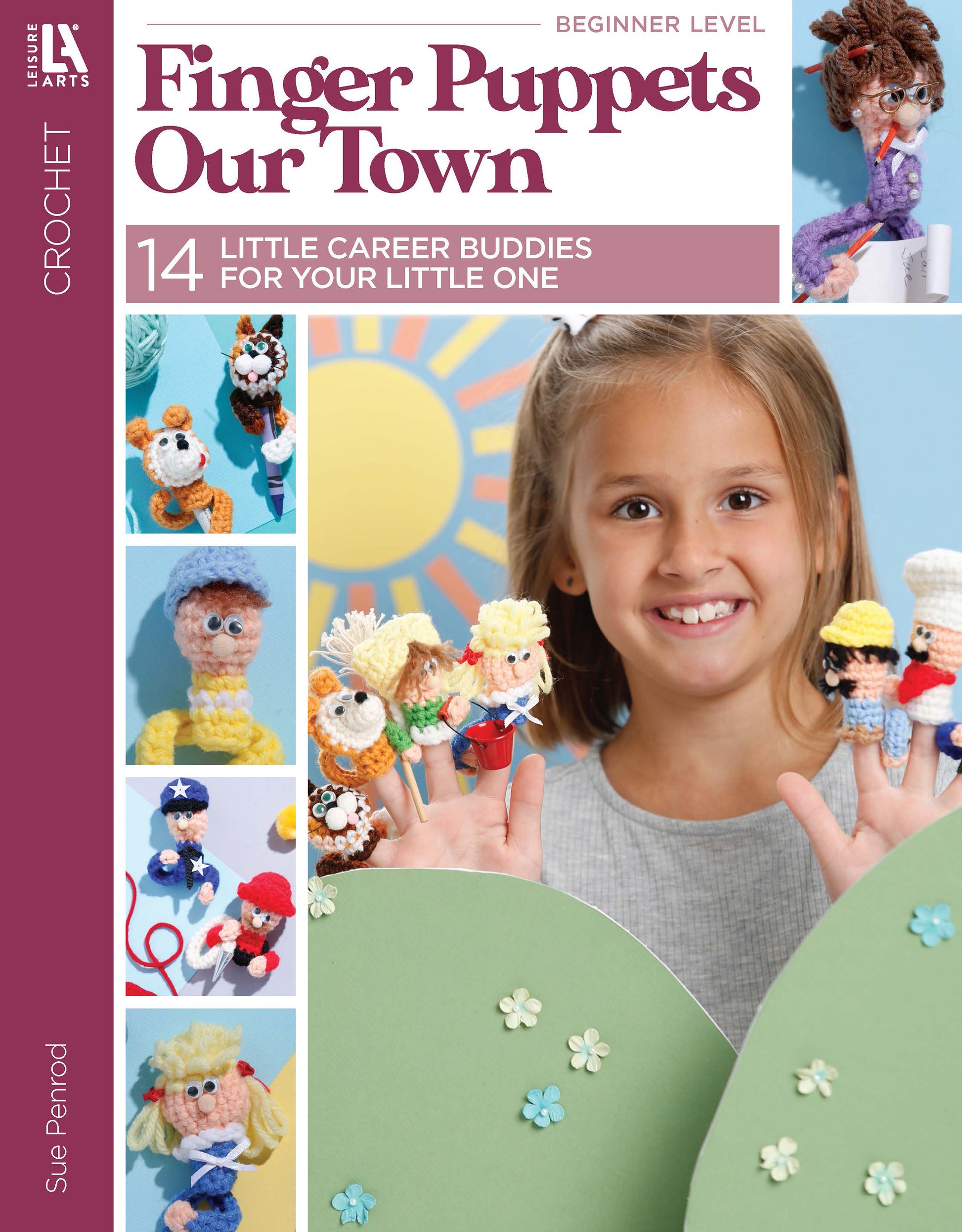 A smiling girl holds crochet finger puppets in career costumes. The Leisure Arts book "Finger Puppets Our Town" features 14 beginner-friendly patterns and colorful puppet photos for your little one.