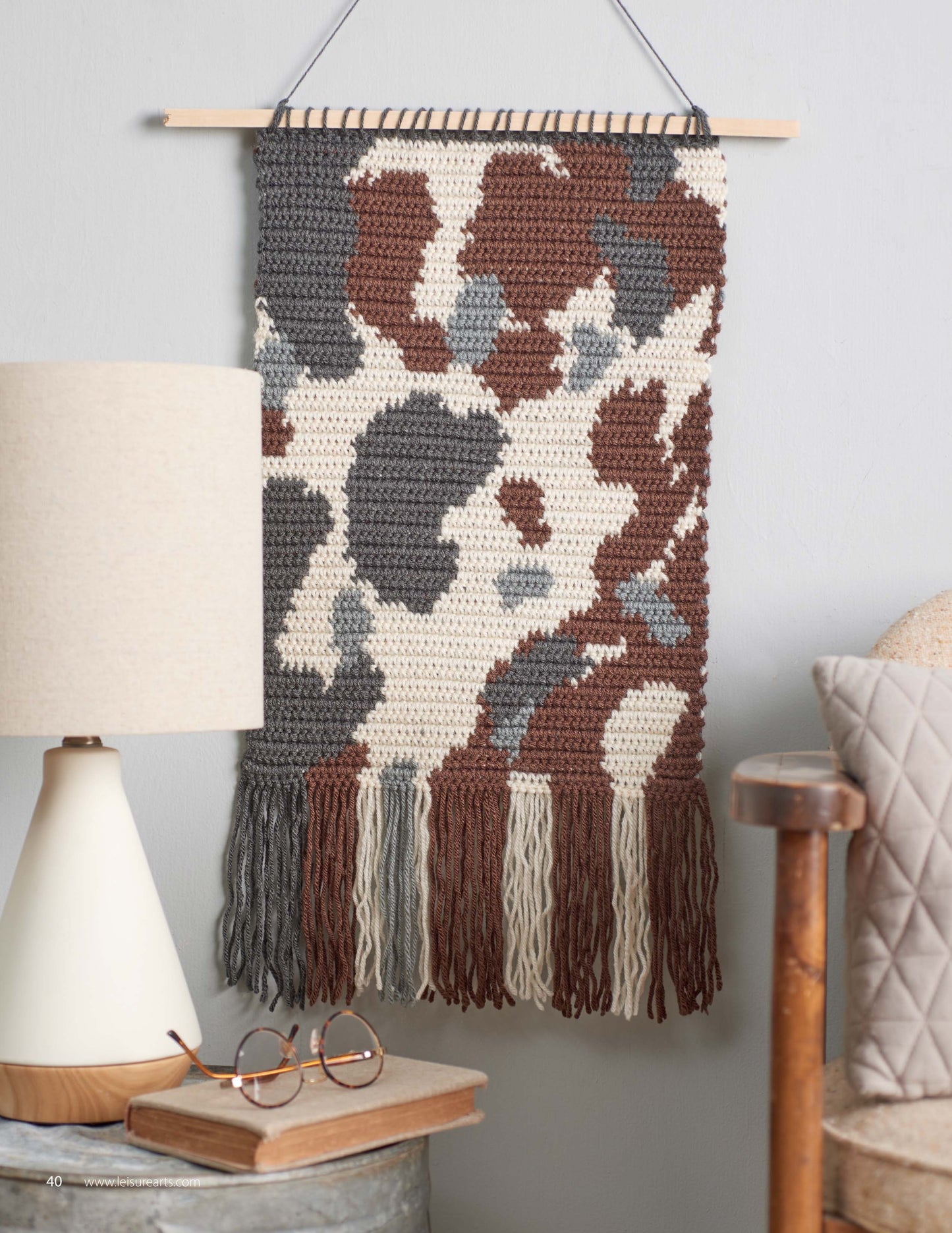 Animal Prints—10 Designs to Add a Little Wildlife to Your Wardrobe and Home Decor by Leisure Arts features beginner-friendly patterns, including wall hangings with animal-inspired abstract designs, ideal for enhancing your home with unique flair.