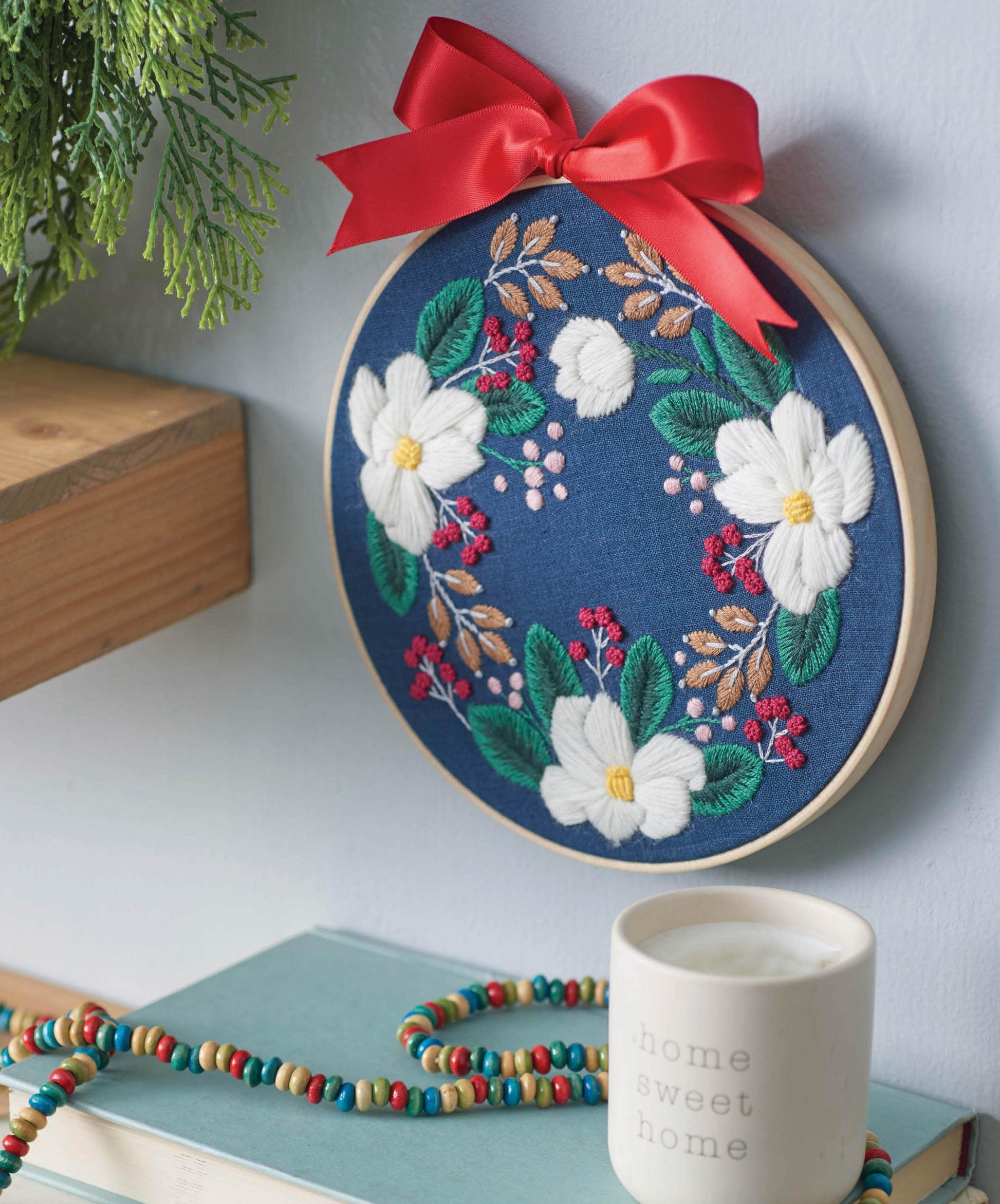Seasonal Embroidery—8 Projects to Complement What You Adore About Every Season by Leisure Arts features charming hoop designs, including floral and bow motifs—perfect home décor or beginner-to-intermediate seasonal craft projects.