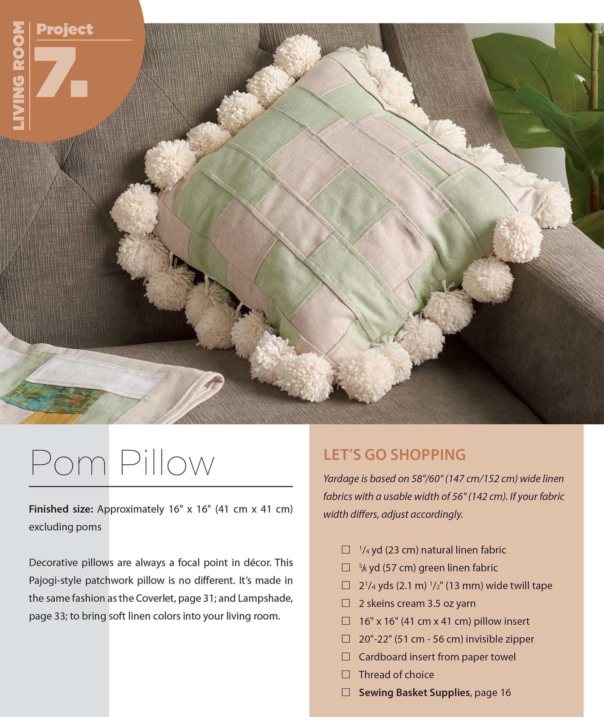 A pastel green and pink checkered pillow with white pom-poms rests on a gray sofa. Pajogi-Style Patchworks by Leisure Arts features Korean patchwork sewing instructions, perfect for inspiring unique home projects.