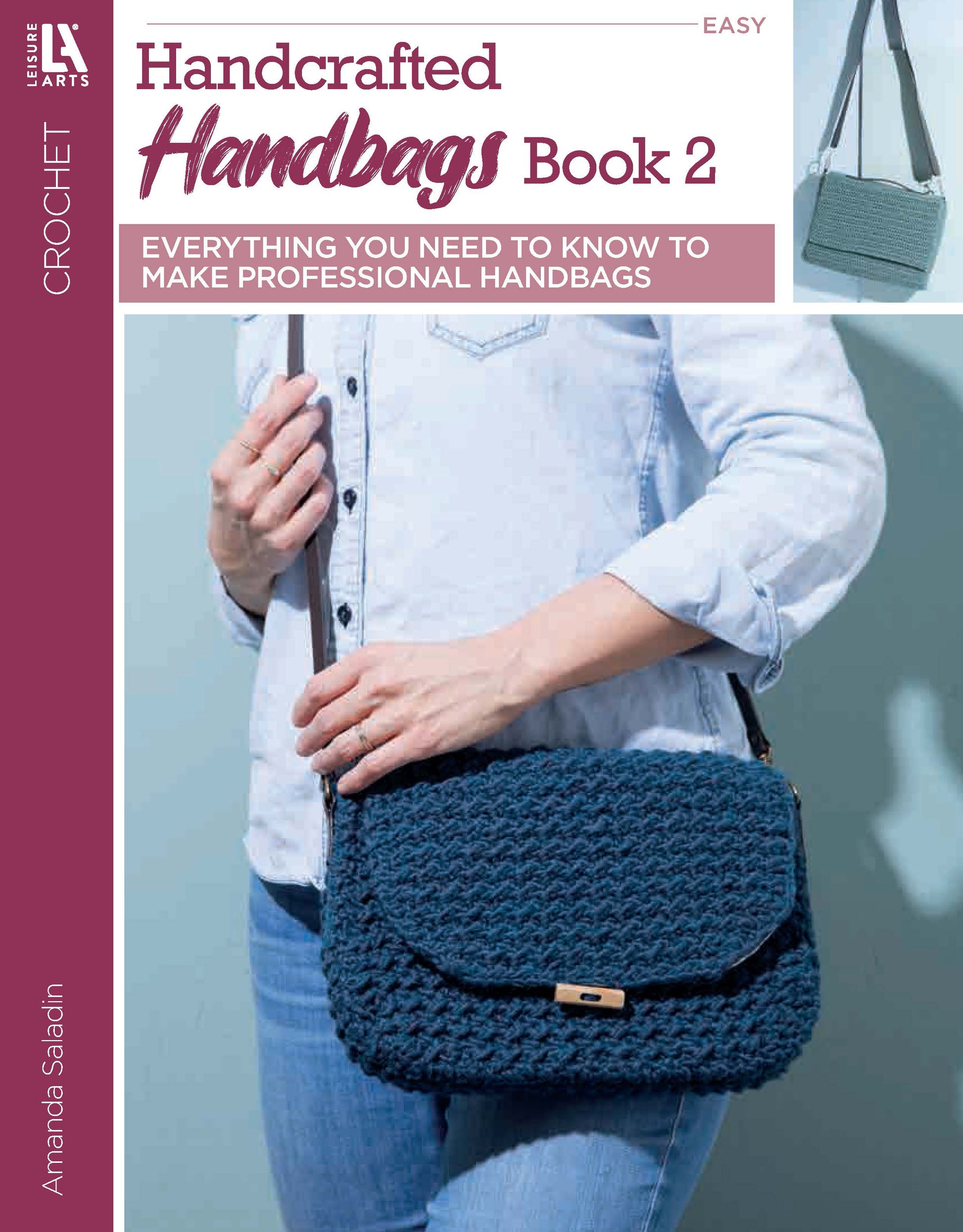 Cover of "Crochet Handcrafted Handbags Book 2" by Leisure Arts: A person in jeans and a light blue shirt holds a dark blue crocheted handbag, with an inset image of a similar bag hanging on a hook—showcasing easy crochet techniques.