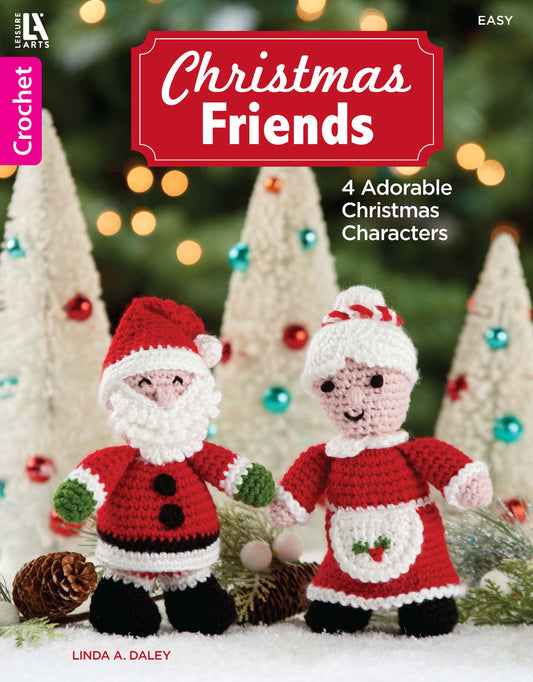 Cover of the crochet pattern book "Christmas Friends—4 Adorable Christmas Characters" by Leisure Arts, featuring Santa and Mrs. Claus dolls among snowy, ornamented trees.
